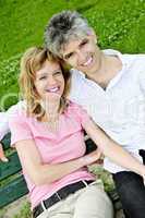 Mature romantic couple on a bench