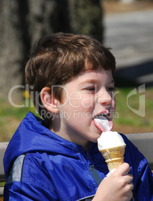 Boy licking ice cream