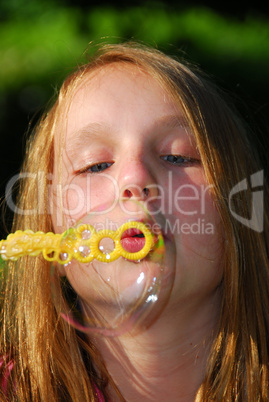 Young girl soap bubbles