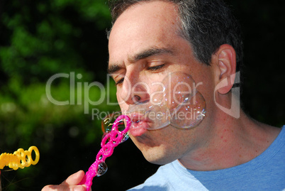 Man blowing bubbles