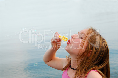 Girl blowing bubbles