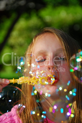 Young girl soap bubbles