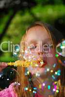 Young girl soap bubbles