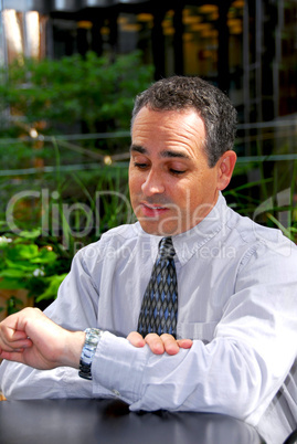 Businessman looking watch