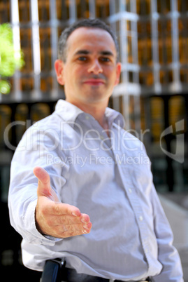 Businessman offering hand