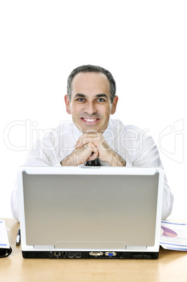 Businessman at his desk on white background