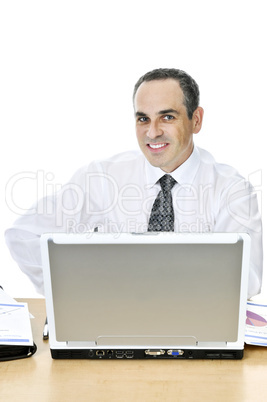 Businessman at his desk on white background