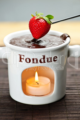 Strawberry dipped in chocolate fondue