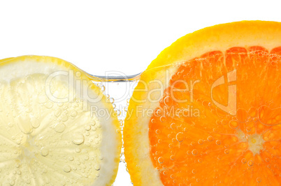Orange and lemon slices in water
