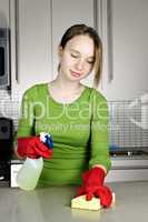 Girl cleaning kitchen
