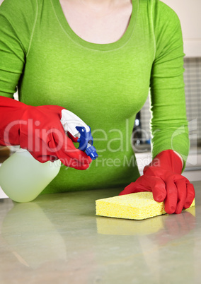 Girl cleaning kitchen