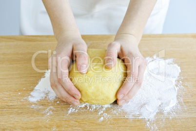 Hands kneading dough