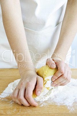 Hands kneading dough