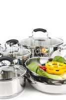 Stainless steel pots and pans with vegetables