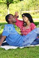 Happy couple having picnic in park