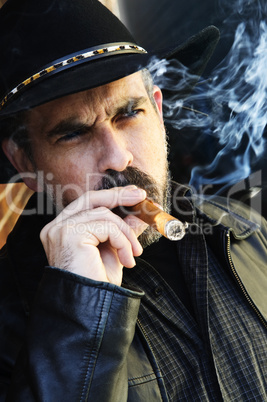 Bearded man smoking cigar