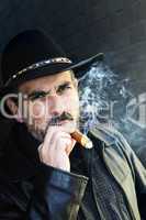 Bearded man smoking cigar