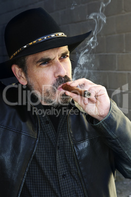 Bearded man smoking cigar