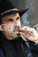 Bearded man smoking cigar