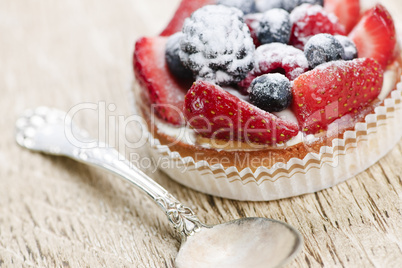 Fruit tart with spoon