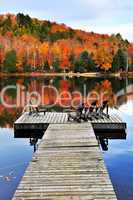 Wooden dock on autumn lake