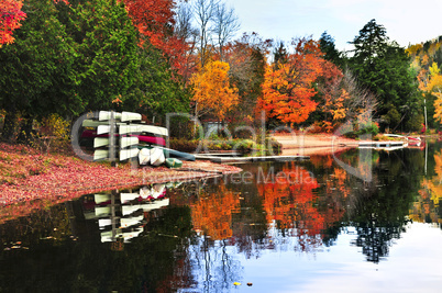 Fall forest reflections with canoes