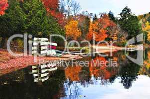 Fall forest reflections with canoes
