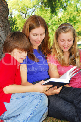 Family reading a book