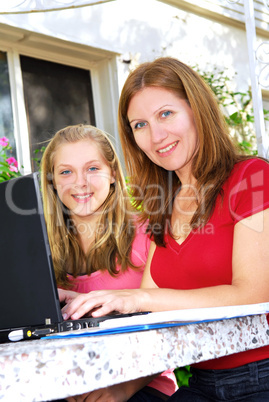 Mother and daughter with computer