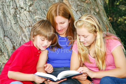 Family reading a book