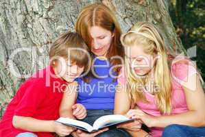 Family reading a book