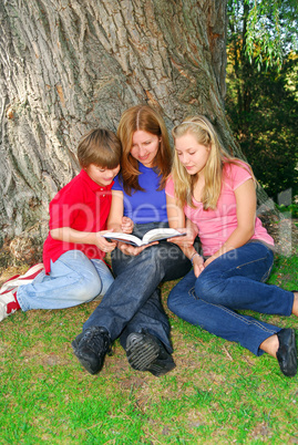 Family reading a book