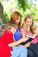 Family reading a book