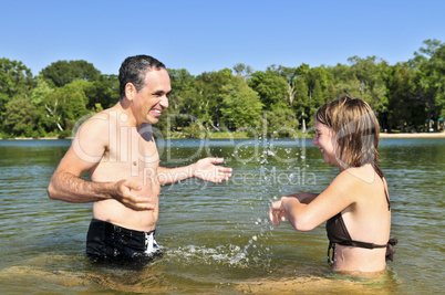 Family splashing in lake