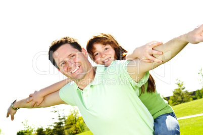 Father and daughter piggyback