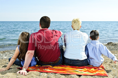 Family sitting at beach