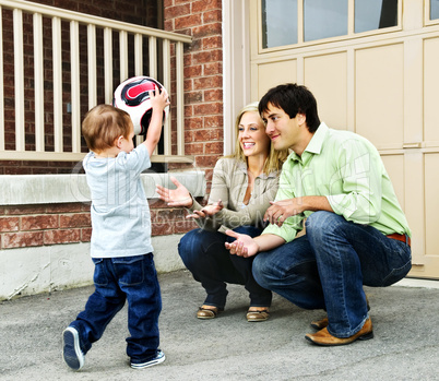 Family playing with soccer ball