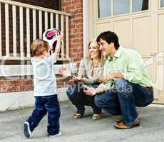 Family playing with soccer ball