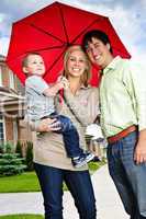 Happy family with umbrella