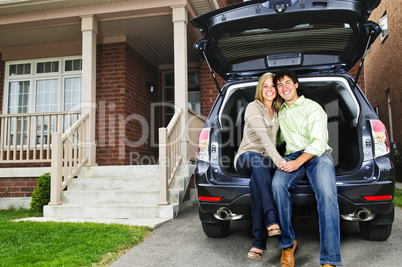 Couple sitting in back of car