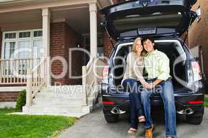 Couple sitting in back of car