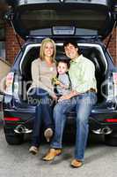 Couple sitting in back of car
