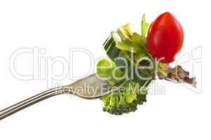 Fresh vegetables on a fork