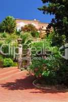 Lush garden in front of a villa