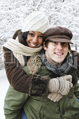 Couple having fun outside in winter