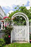 White arbor in a garden