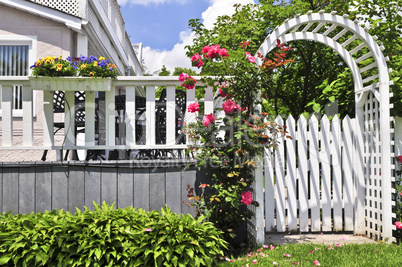 White arbor in a garden