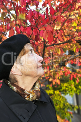 Senior woman in fall park