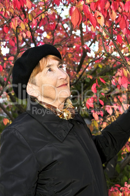 Senior woman in fall park