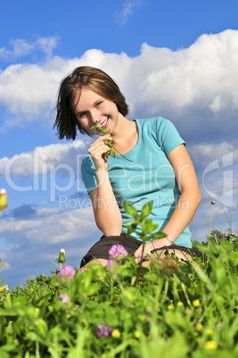 Young girl sitting on grass